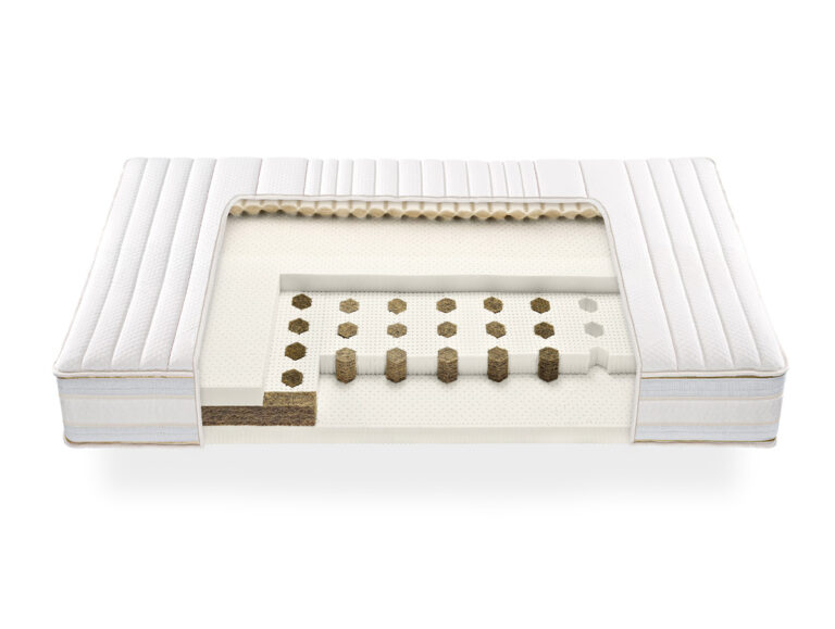 Die Talalay-Latexmatratze "DreamOn" zeichnet sich durch sichtbare Innenschichten aus Spiralen und Polstern aus, die ihre hochwertige Verarbeitung unterstreichen. Ein weißer, gesteppter Bezug sorgt für einen luxuriösen Touch.