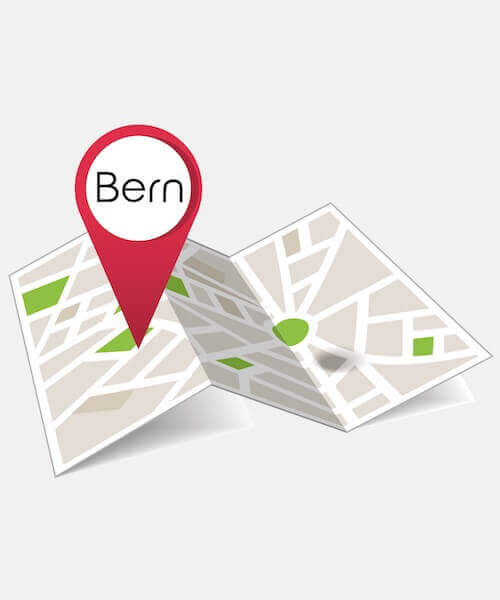 Eine illustrierte Karte mit einer grossen roten Ortsmarkierung mit der Aufschrift Bern, mit vereinfachten Strassen und grünen Flächen zur Darstellung eines Stadtgrundrisses. Bewerten Sie uns und teilen Sie Ihr Feedback zu Ihrem Bern-Erlebnis!.